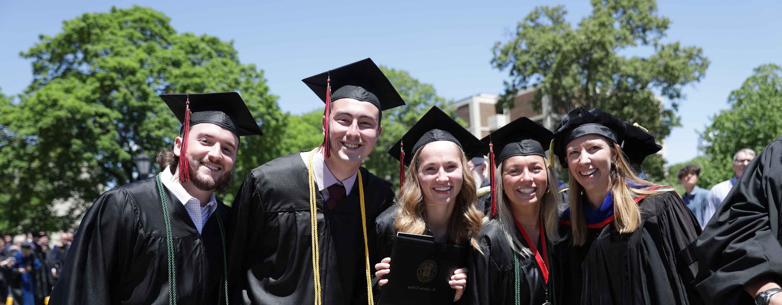 Graduates celebrating after Commencement